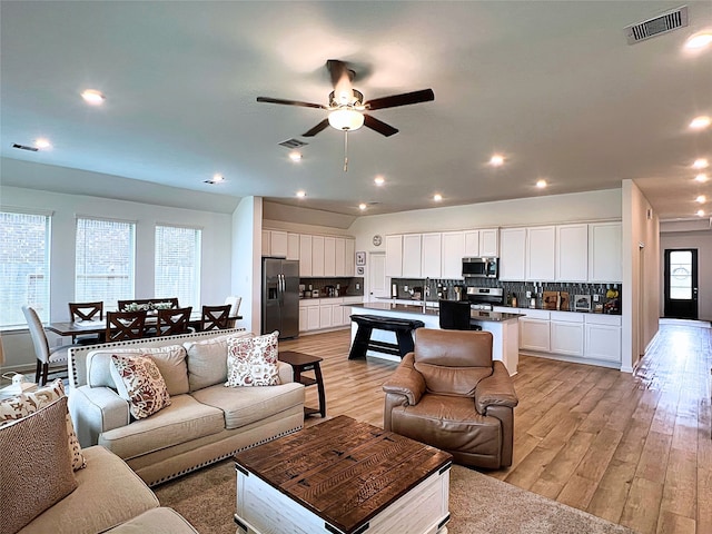 19022 Palizzi Ridge Ln, New Caney, TX 77357 - living room with a ceiling fan, light wood finished floors, and recessed lighting