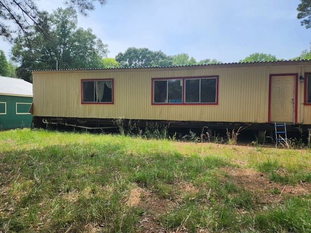 763 Timberline Dr, Onalaska, TX 77360 - view of side of home featuring a metal roof
