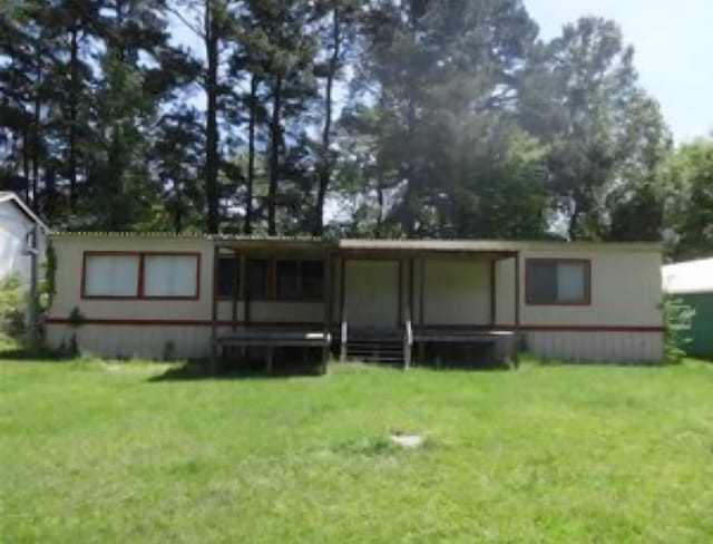 763 Timberline Dr, Onalaska, TX 77360 - rear view of property featuring a yard