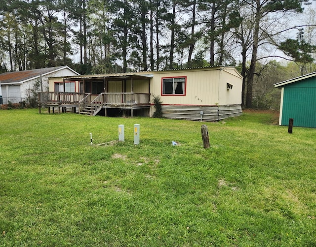 763 Timberline Dr, Onalaska, TX 77360 - view of front facade featuring a front yard and a wooden deck