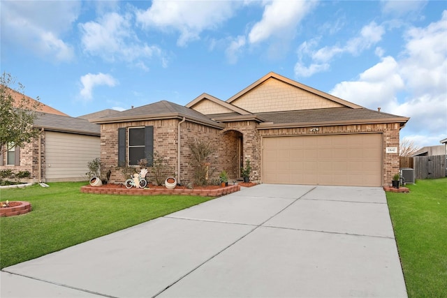 11642 Bodark Valley Ln, Houston, TX 77038 - view of front of home featuring a front yard, brick siding, concrete driveway, and an attached garage