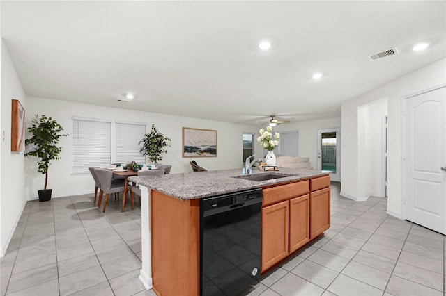 11642 Bodark Valley Ln, Houston, TX 77038 - kitchen with black dishwasher, recessed lighting, light tile patterned floors, a kitchen island with sink, and a ceiling fan