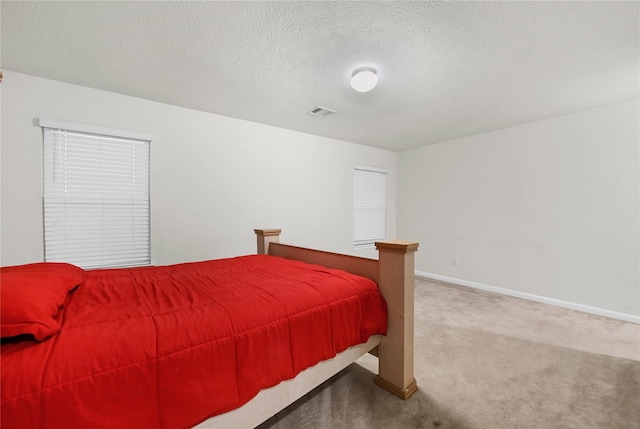 11642 Bodark Valley Ln, Houston, TX 77038 - carpeted bedroom with baseboards and a textured ceiling
