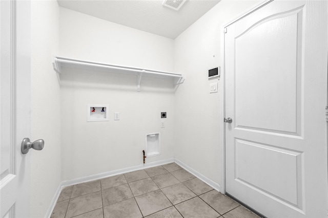 11642 Bodark Valley Ln, Houston, TX 77038 - washroom with washer hookup, light tile patterned flooring, and electric dryer hookup