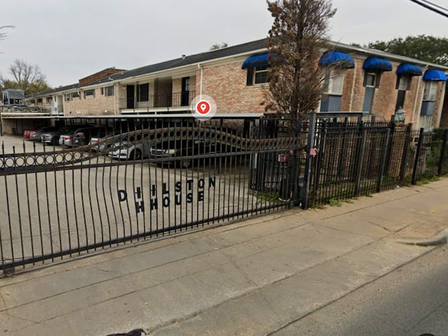 7900 Westheimer Rd Unit 112, Houston, TX 77063 - ranch-style home featuring brick siding and covered parking