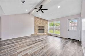 19314 Cypress Arbor Ct, Katy, TX 77449 - unfurnished living room with ceiling fan, wood finished floors, and a fireplace