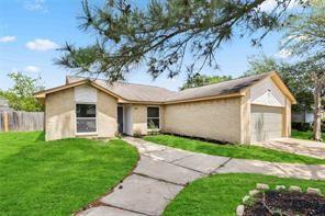 19314 Cypress Arbor Ct, Katy, TX 77449 - view of front of house featuring stucco siding, a garage, and driveway