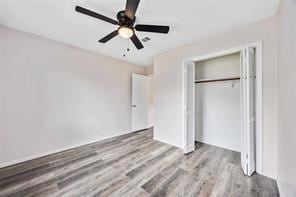 19314 Cypress Arbor Ct, Katy, TX 77449 - unfurnished bedroom featuring wood finished floors, a closet, and ceiling fan