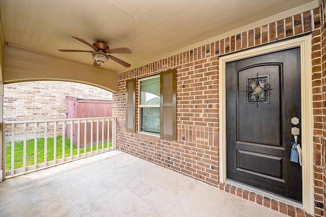 23014 Indigo Prairie Ln, Katy, TX 77493 - property entrance featuring brick siding, ceiling fan, and a porch