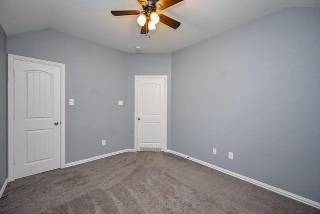 23014 Indigo Prairie Ln, Katy, TX 77493 - unfurnished bedroom with vaulted ceiling, dark carpet, and a ceiling fan