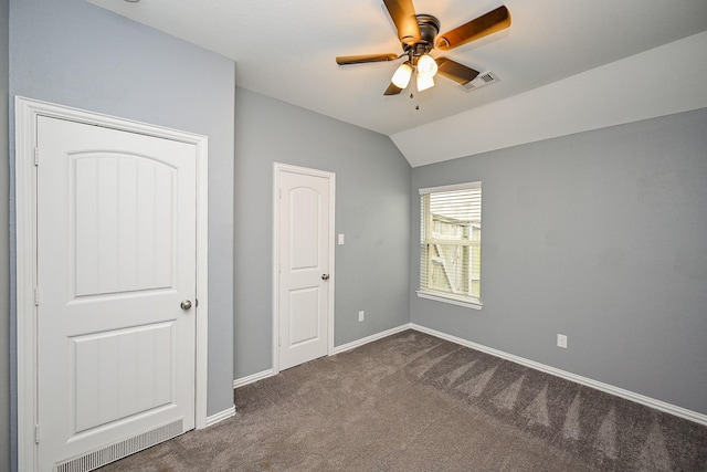 23014 Indigo Prairie Ln, Katy, TX 77493 - unfurnished bedroom featuring dark colored carpet, vaulted ceiling, and a ceiling fan