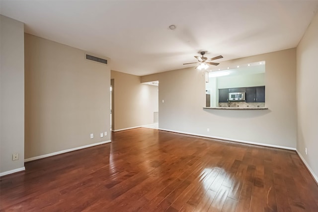 15 Greenway Plz Unit 5C, Houston, TX 77046 - unfurnished living room featuring a ceiling fan and wood finished floors