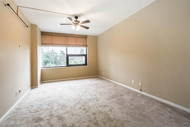 15 Greenway Plz Unit 5C, Houston, TX 77046 - carpeted empty room featuring ceiling fan and baseboards