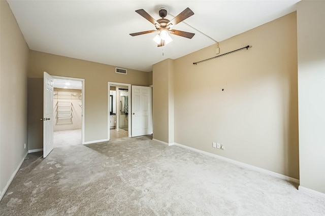 15 Greenway Plz Unit 5C, Houston, TX 77046 - unfurnished bedroom featuring carpet floors, ensuite bath, and ceiling fan