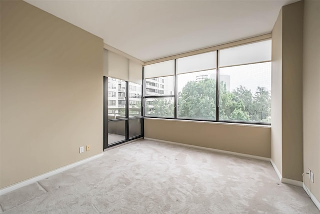 15 Greenway Plz Unit 5C, Houston, TX 77046 - carpeted empty room with baseboards