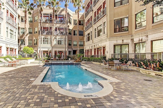 1901 Post Oak Unit 302, Houston, TX 77056 - community pool featuring a patio area