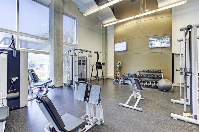 1901 Post Oak Unit 302, Houston, TX 77056 - exercise room featuring a towering ceiling