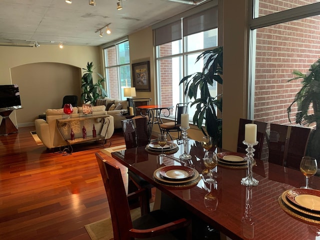 1901 Post Oak Unit 302, Houston, TX 77056 - dining space featuring track lighting and wood finished floors