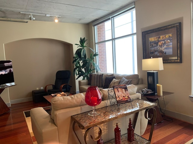 1901 Post Oak Unit 302, Houston, TX 77056 - living room with wood finished floors and rail lighting