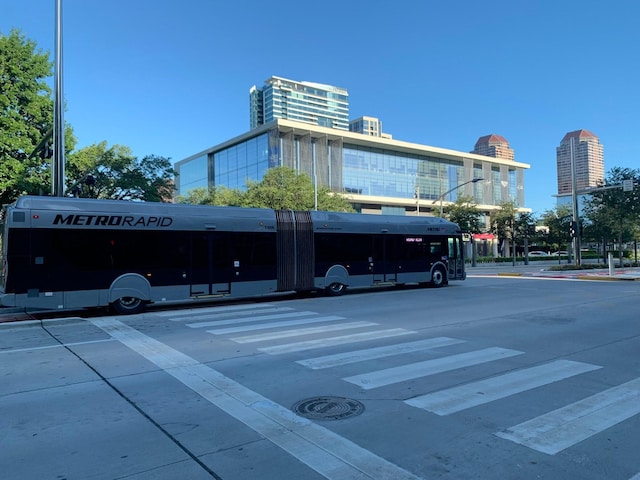 1901 Post Oak Unit 302, Houston, TX 77056 - view of building exterior featuring uncovered parking