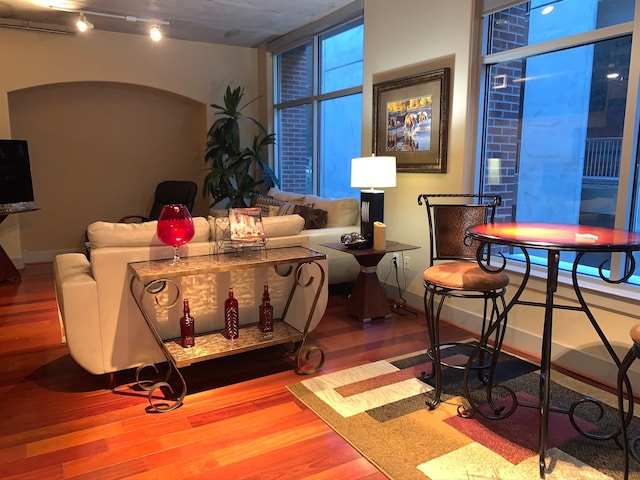 1901 Post Oak Unit 302, Houston, TX 77056 - living area with wood finished floors and track lighting