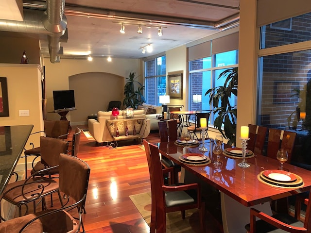 1901 Post Oak Unit 302, Houston, TX 77056 - dining area with wood finished floors and track lighting