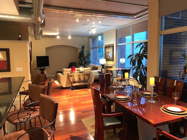 1901 Post Oak Unit 302, Houston, TX 77056 - dining room with wood finished floors and track lighting
