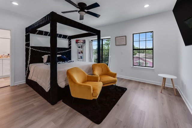 727 E 40th St, Houston, TX 77022 - bedroom with wood finished floors, recessed lighting, connected bathroom, and ceiling fan