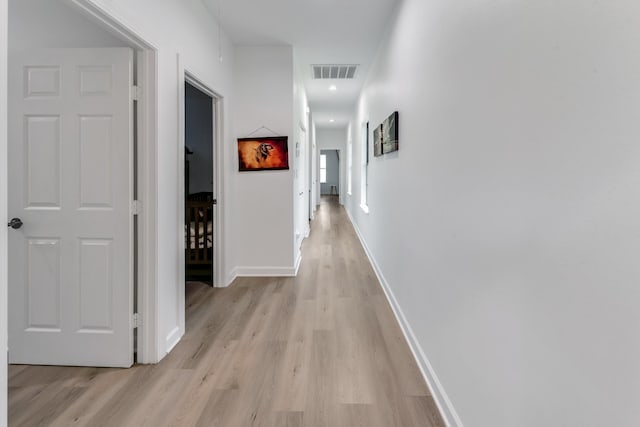 727 E 40th St, Houston, TX 77022 - hallway featuring light wood finished floors and baseboards