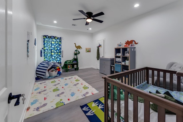 727 E 40th St, Houston, TX 77022 - bedroom featuring wood finished floors, recessed lighting, and a ceiling fan