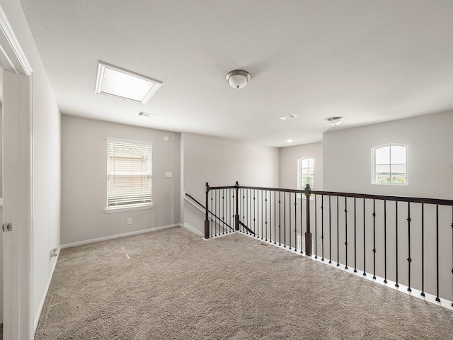 12519 Crathie Dr, Humble, TX 77346 - hallway with carpet floors and an upstairs landing