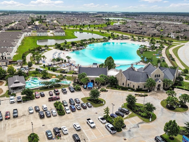 12519 Crathie Dr, Humble, TX 77346 - aerial view of residential area featuring a pool area and a nearby body of water