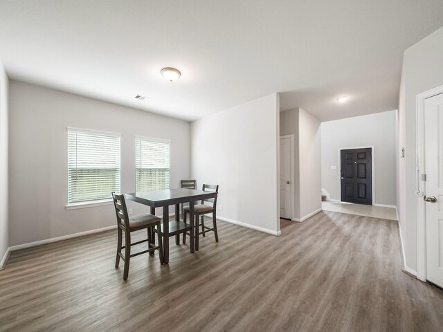 12519 Crathie Dr, Humble, TX 77346 - dining area with wood finished floors and baseboards