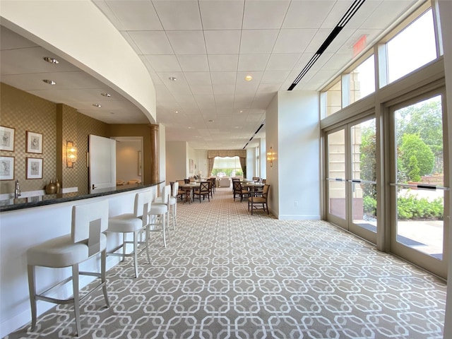 1100 Uptown Park Blvd Unit 23, Houston, TX 77056 - bar with carpet and recessed lighting