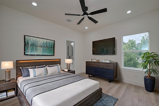 2422 Dalview St, Houston, TX 77091 - bedroom with light wood finished floors, recessed lighting, and ceiling fan