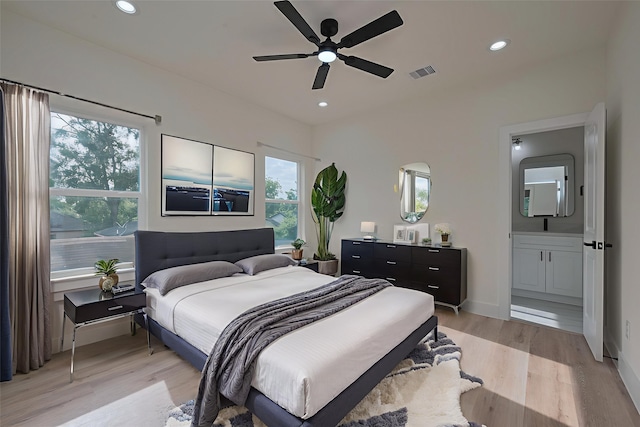 2422 Dalview St, Houston, TX 77091 - bedroom featuring light wood-style flooring, recessed lighting, connected bathroom, and ceiling fan