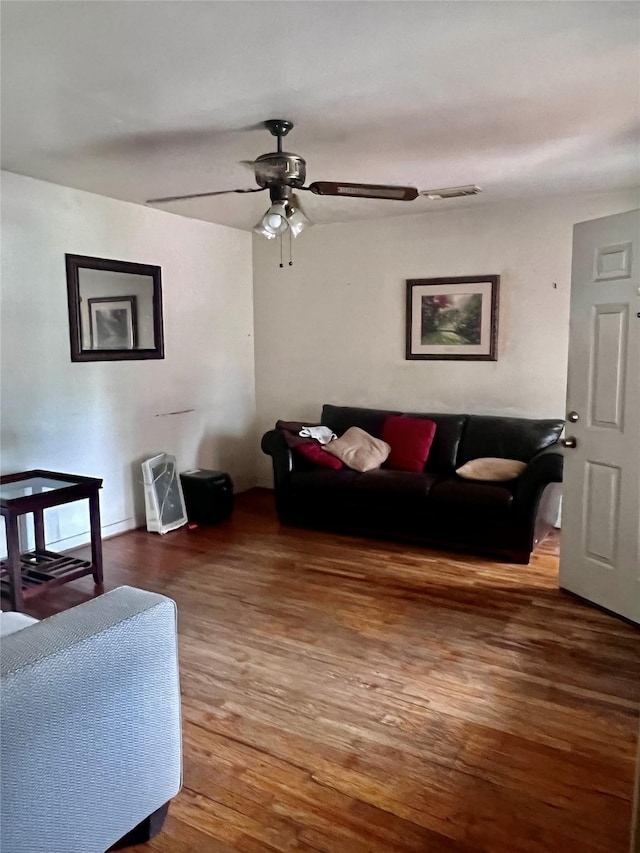 1410 Caplin St, Houston, TX 77022 - living room with a ceiling fan and wood finished floors