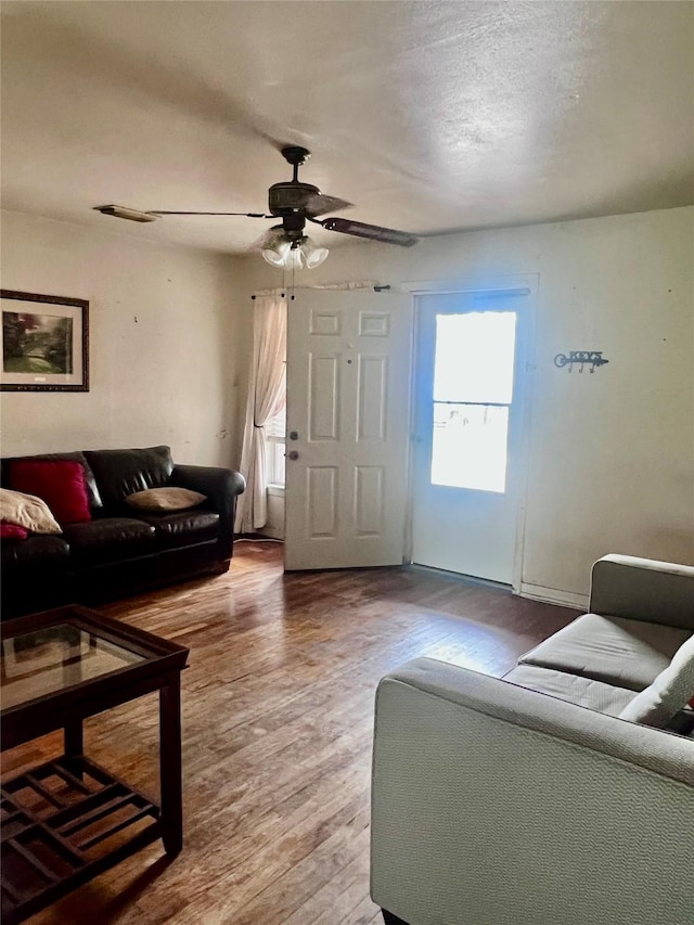1410 Caplin St, Houston, TX 77022 - living area with ceiling fan and wood finished floors