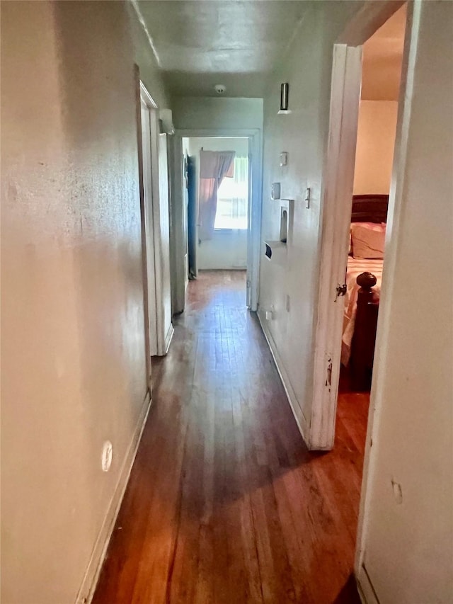 1410 Caplin St, Houston, TX 77022 - corridor featuring wood finished floors and baseboards