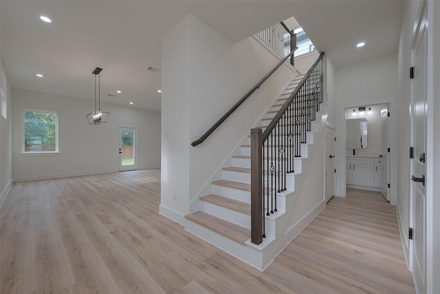 2420 Dalview St, Houston, TX 77091 - stairway with wood finished floors, recessed lighting, and a high ceiling