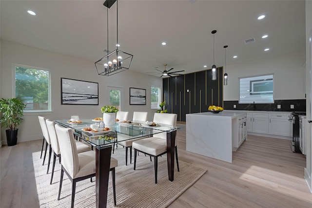 2420 Dalview St, Houston, TX 77091 - dining room with light wood finished floors, a ceiling fan, plenty of natural light, recessed lighting, and a chandelier