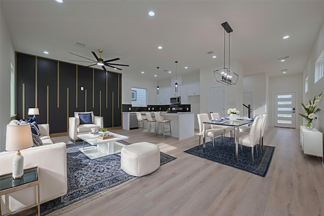 2420 Dalview St, Houston, TX 77091 - living area with light wood-style floors, recessed lighting, ceiling fan, and a chandelier