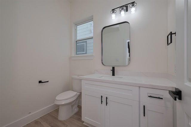 2420 Dalview St, Houston, TX 77091 - half bath featuring vanity and wood finished floors
