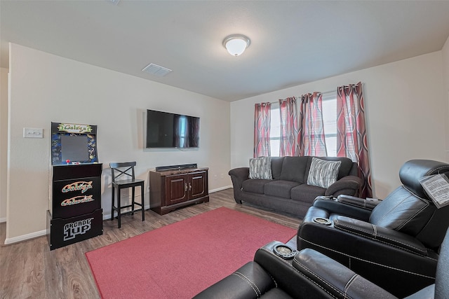 10434 Lake Of The Ozarks Dr, Humble, TX 77396 - living area featuring wood finished floors and baseboards