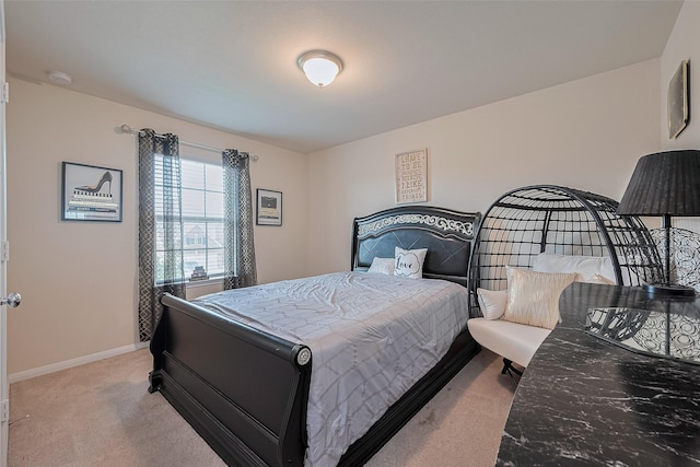 10434 Lake Of The Ozarks Dr, Humble, TX 77396 - bedroom with light colored carpet and baseboards
