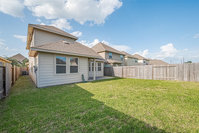 10434 Lake Of The Ozarks Dr, Humble, TX 77396 - rear view of property with a fenced backyard, a shingled roof, and a patio area
