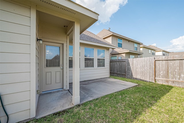 10434 Lake Of The Ozarks Dr, Humble, TX 77396 - view of exterior entry with a patio and roof with shingles