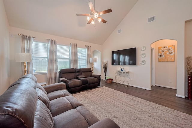 10434 Lake Of The Ozarks Dr, Humble, TX 77396 - living area with arched walkways, ceiling fan, high vaulted ceiling, and dark wood finished floors