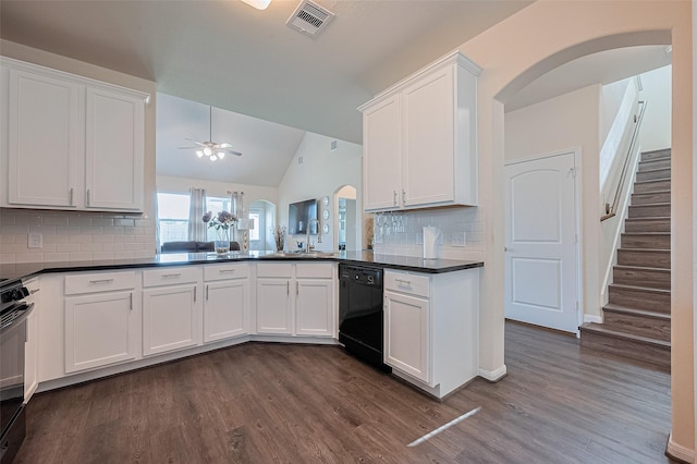 10434 Lake Of The Ozarks Dr, Humble, TX 77396 - kitchen with black appliances, a ceiling fan, dark countertops, dark wood-style floors, and vaulted ceiling
