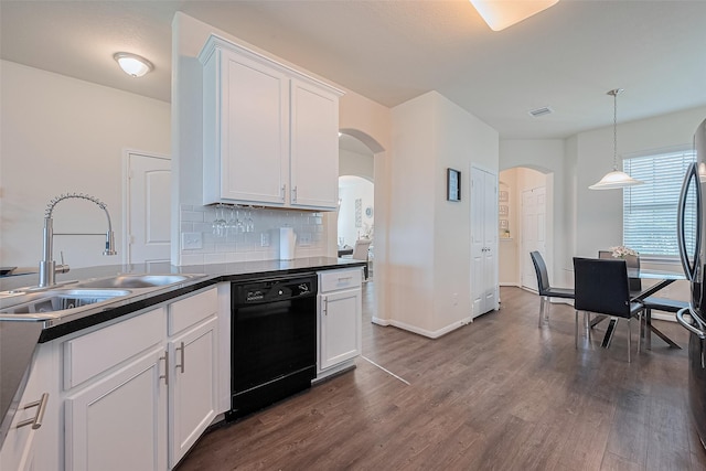 10434 Lake Of The Ozarks Dr, Humble, TX 77396 - kitchen with dishwasher, arched walkways, dark countertops, and dark wood-style flooring